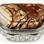 A Victorian silver snuff box of shaped outline, the lid inset with moss agate,