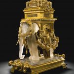 A GILT-BRONZE-MOUNTED MOULDED AND BLOWN FROSTED AND PEARLISED CUT CRYSTAL "ELEPHANT" `CAVE À LIQUEUR'
