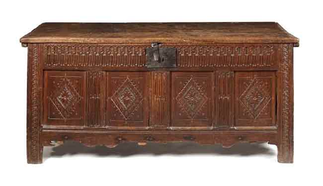 An Elizabethan oak chest with plank lid