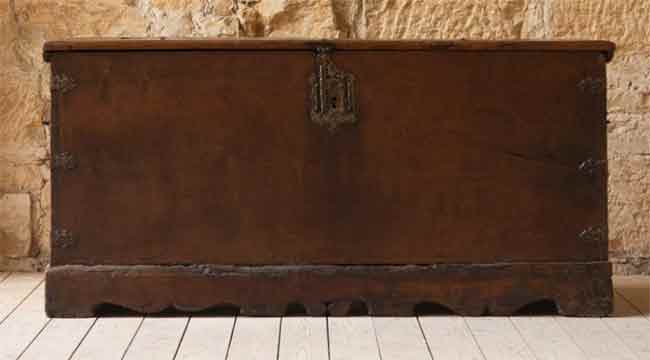 A large mid-18th century walnut and iron bound coffer