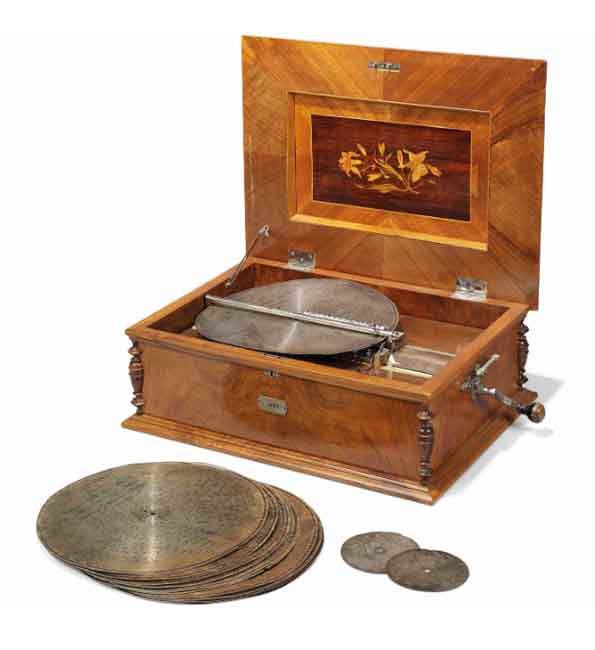 A SWISS WALNUT-CASED AND ROSEWOOD AND FRUITWOOD INLAID 'STELLA DISC' MUSICAL BOX